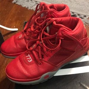 Red Adidas basketball shoes